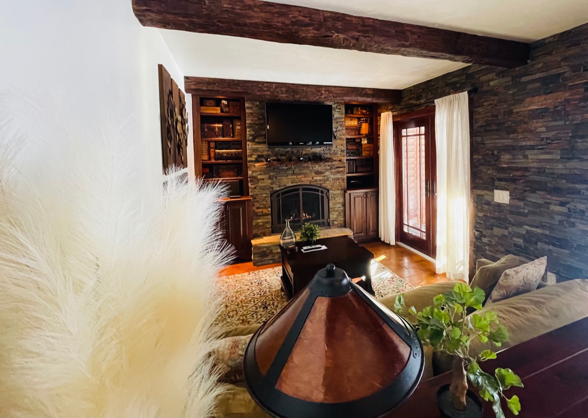 Chicken Coop living room with stone fireplace