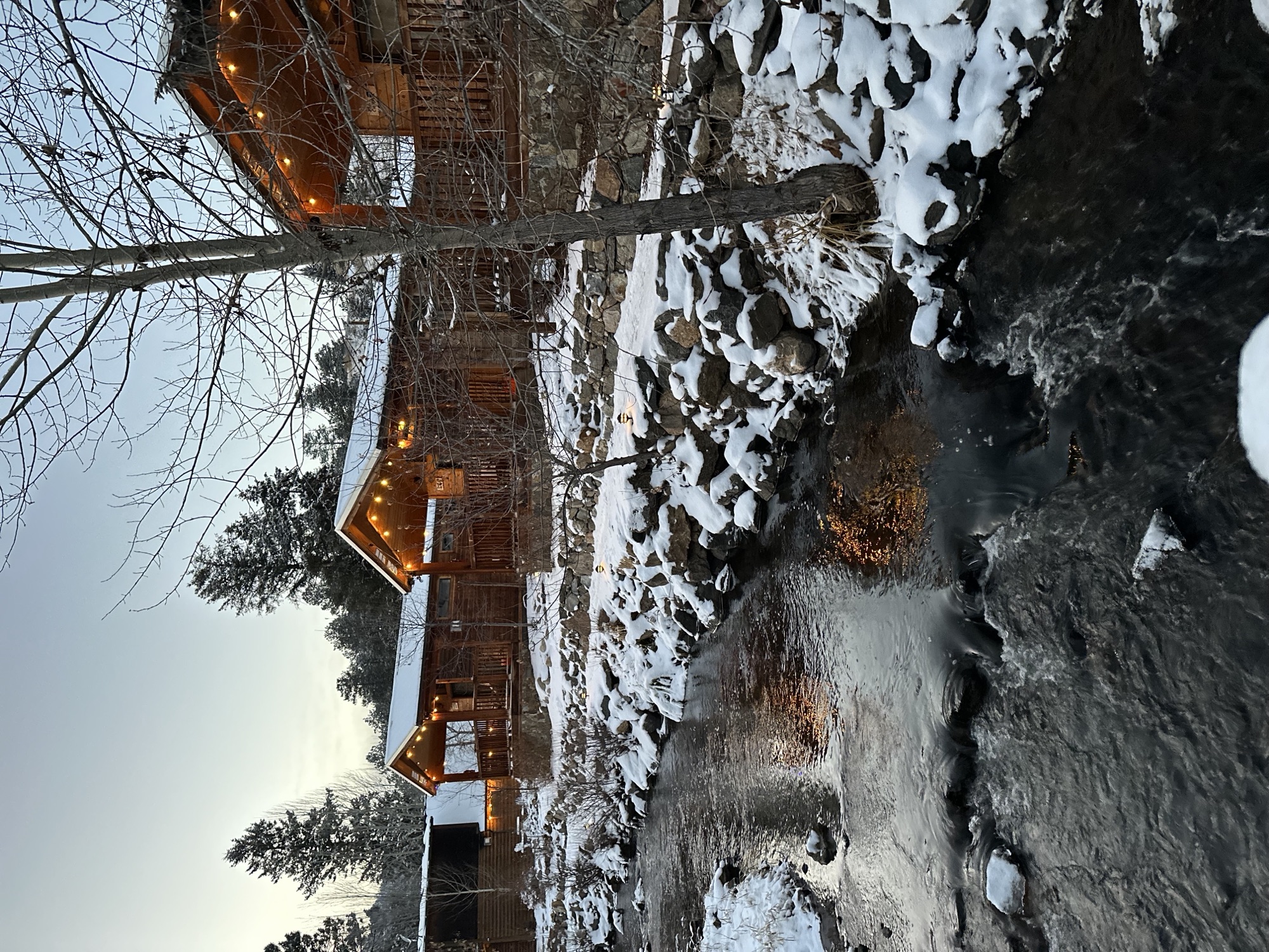 Cabin along snowy creek